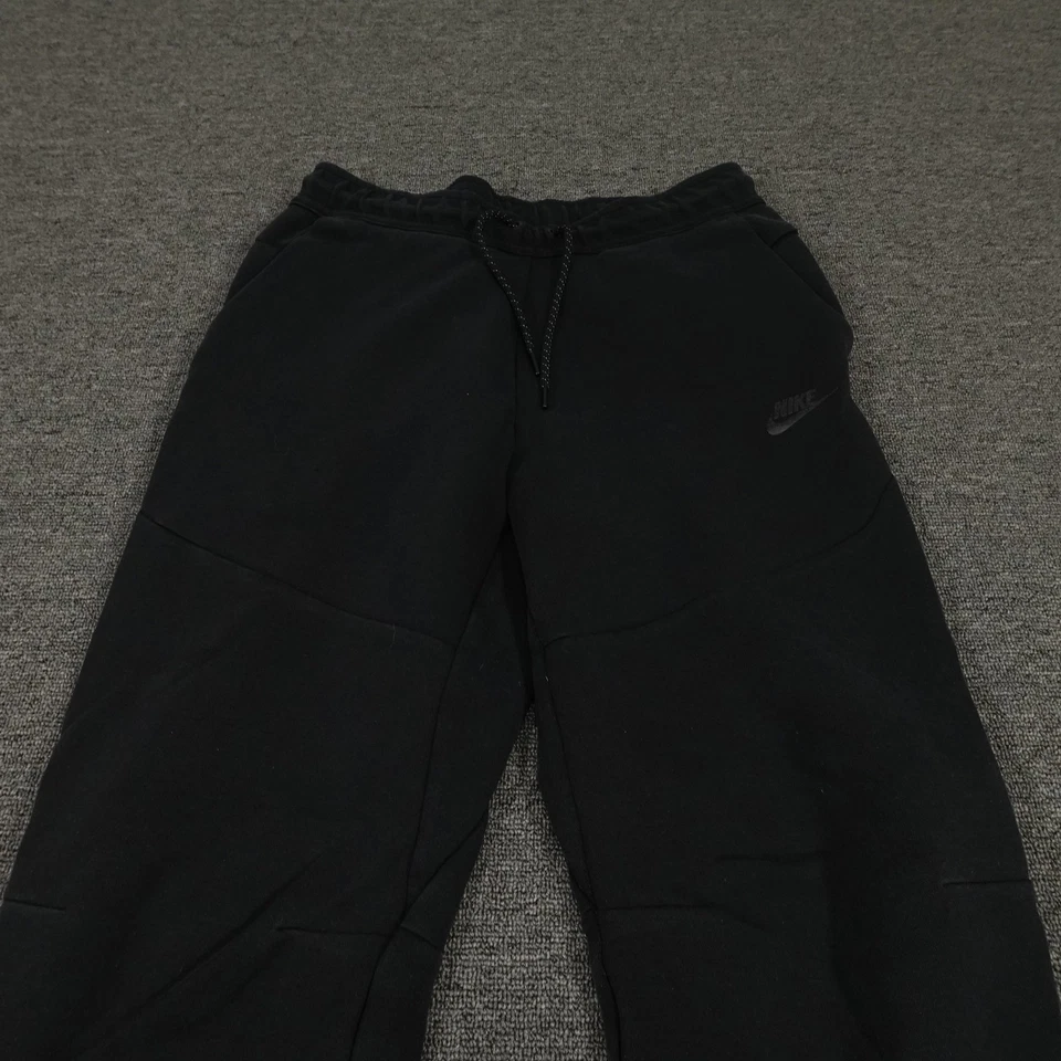 Pantalones Nike Juveniles Medianos Negros Tecnología Polar Joggers Pantalones de Sudadera con Puños Cónicos Foto 2 de 4