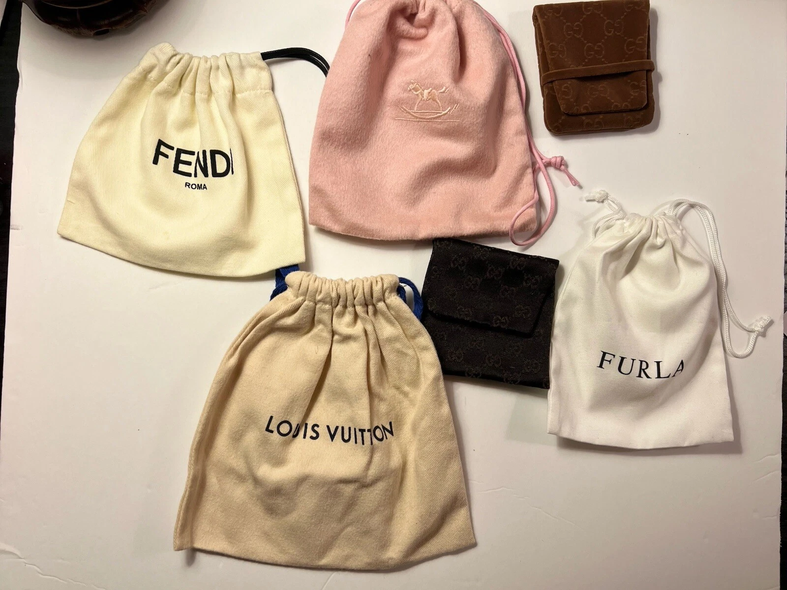 Lot de 6 pochette à bijoux créateur Gucci Furla Louis Vuitton Fendi pochette pliée