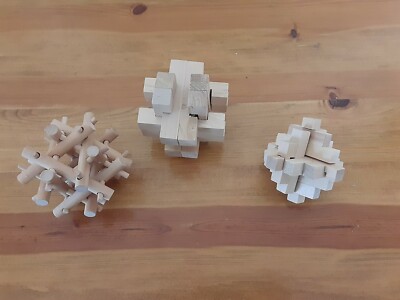 3 Wooden Brain Teaser Puzzles And 1 Rubiks Cube