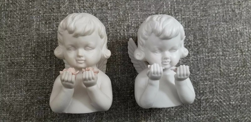 Pair of Angels Holding Flowers