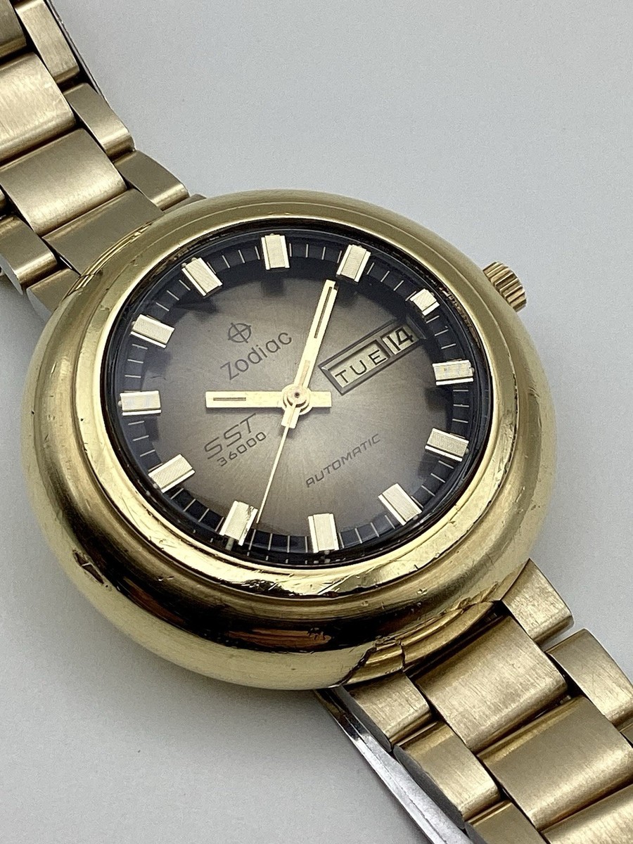 Zodiac Swiss SST 36000 UFO Case Gold G20 Day Date Automatic Keeps