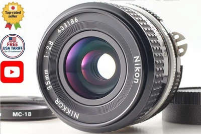 ⏯ [NEUF] Objectif grand angle Nikon Ai Nikkor 35 mm f/2,8 MF avec bouchons... - Photo 1/4
