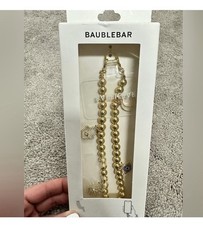 BaubleBar Gold Beaded Phone Wristlet with Charms