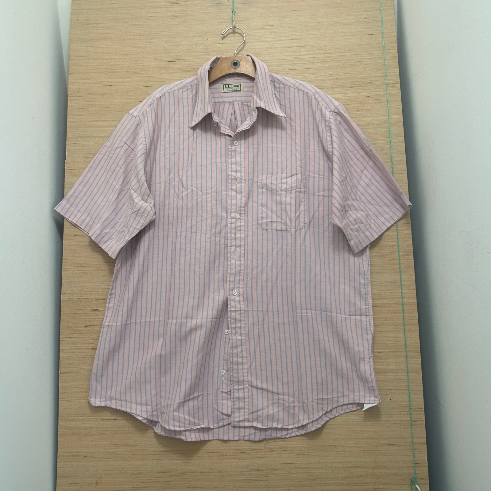 Pink and blue vertically striped vintage LL Bean men’s short sleeve Oxford shirt with button-down front and single chest pocket.