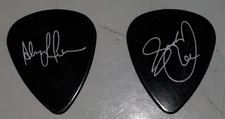 Rush - Alex Lifeson and Geddy Lee signed guitar picks, 2004 R30 Anniversary Tour