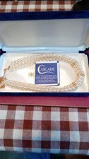 Cascade multi-strand simulated pearl necklace rhinestone-encrusted separators