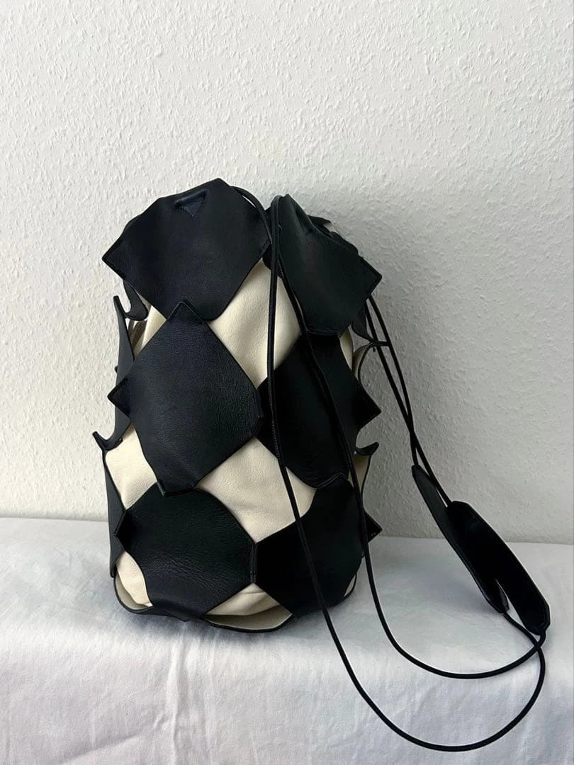 Jil Sander leather drawstring bag, cylindrical PUZZLE bucket bag