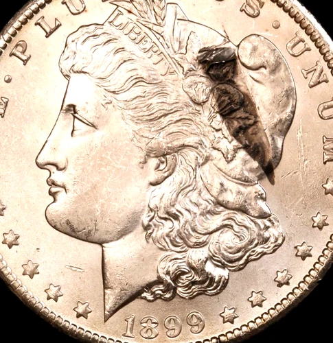 Major attached Lamination Error   1899-O Morgan Dollar - - Brilliant Unc