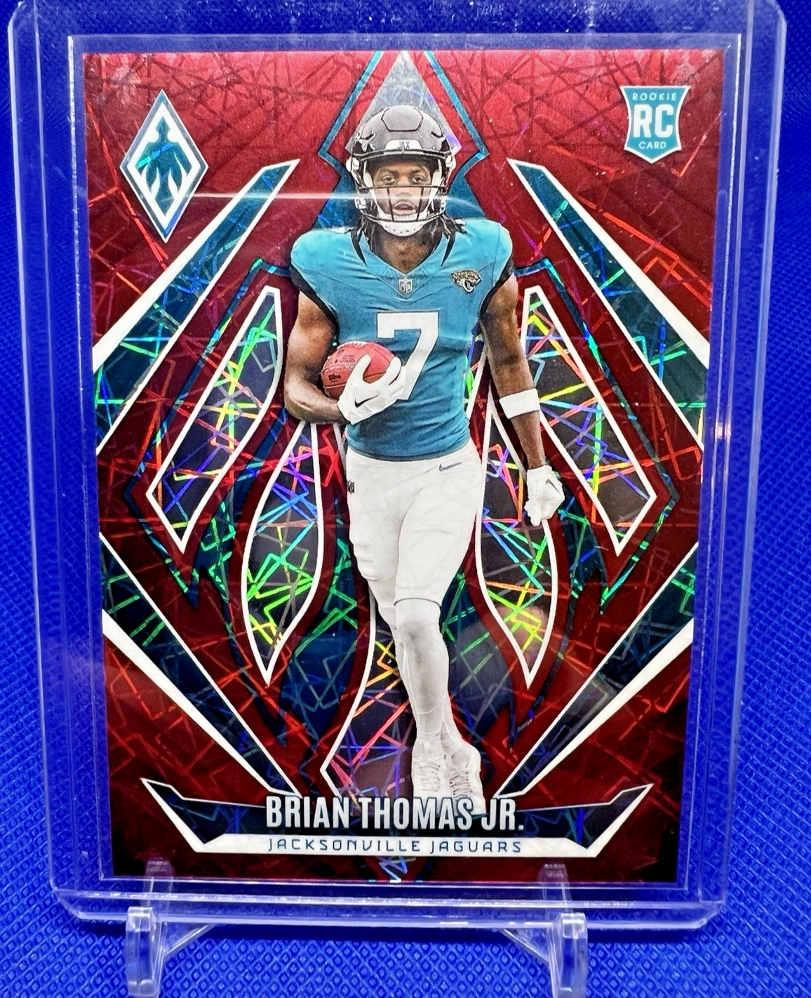 2024 Panini Phoenix - Rookies Brian Thomas Jr. #164 Red Lazer 003/199 (RC)