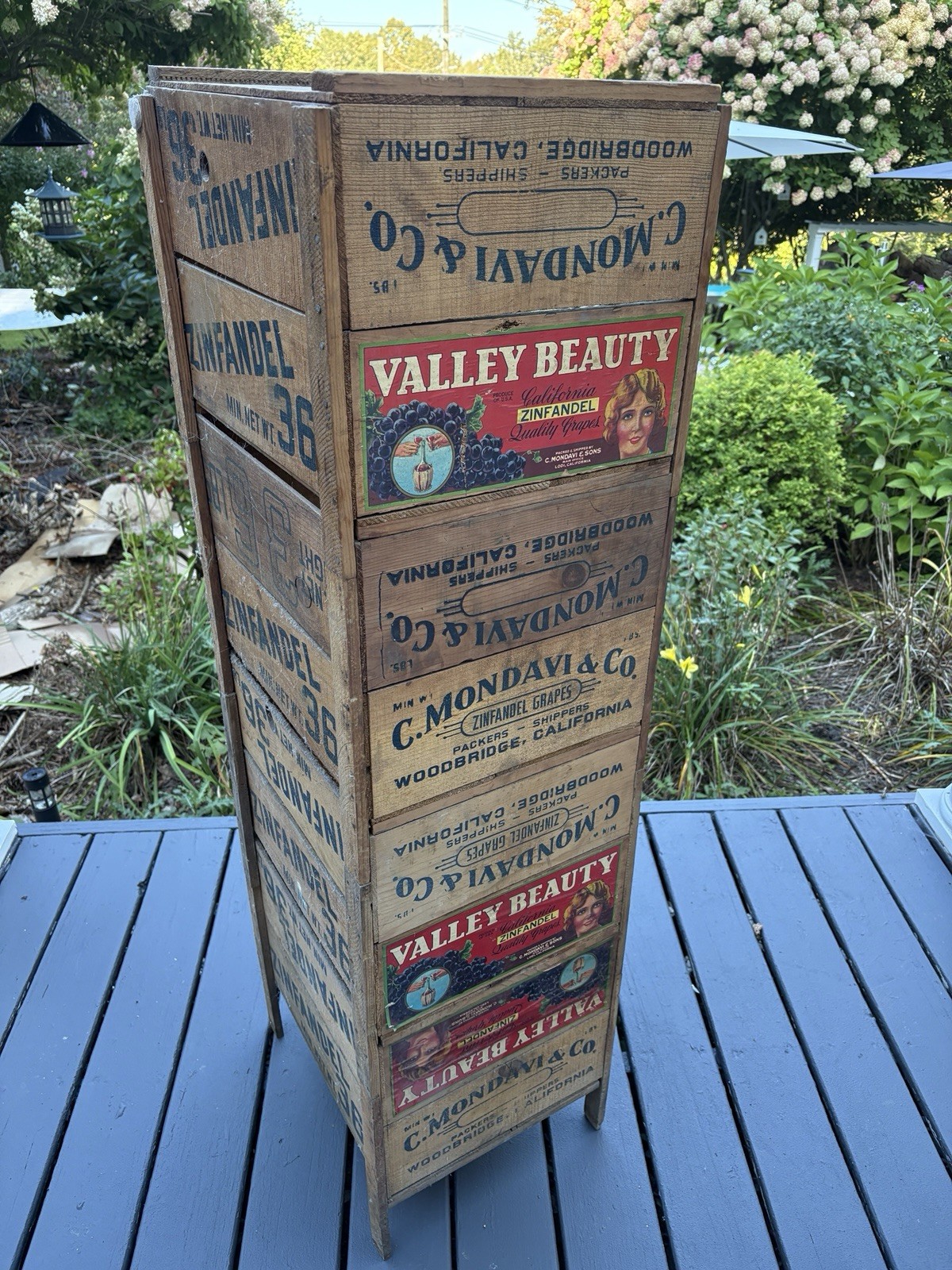 Beautiful original bookcase made out of antique farm boxes with original labels.