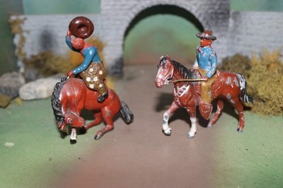 UNIQUE LEAD TOY COWBOYS ON BUCKING BRONCO HORSE  & ONE CANTERING -1940-50