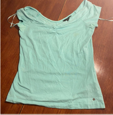 Used Guess Top. Had small stains but barely noticeable! Very cute top!