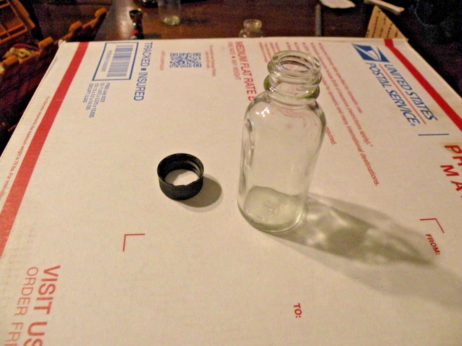 2 oz clear glass bottles with black twist on lids 25 pcs