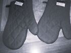 New pair of dark gray quilted oven mitts