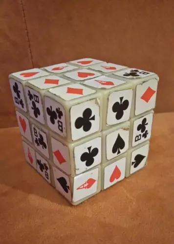 Rubik's cube 80's with playing card suits. Toy puzzle