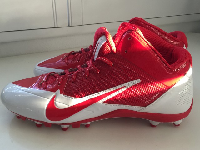 orange and white cleats