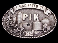 LI03163 VINTAGE 1983 I WAS SAVED BY PIK PAYMENT IN KIND FARMING BUCKLE