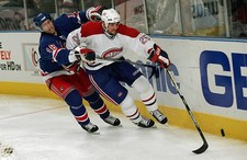 Defenseman Mathieu Dandenault Montreal Canadiens battles beh- Ice Hockey Photo