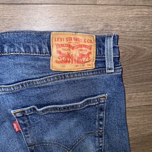 Pantaloncini jeans Levi's 512 Distressed 8 pollici taglio cuciture denim uomo 34 lavaggio medio - Foto 13 di 14