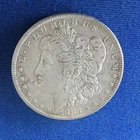 1883-O Morgan Silver Dollar having AU details with a nice surface and feathers.