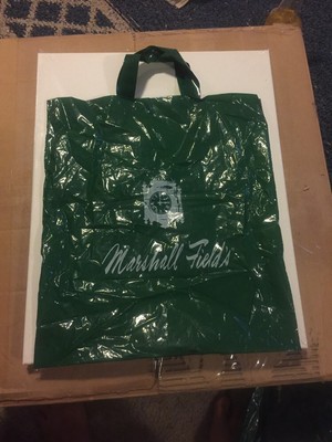 MARSHALL FIELD'S GREEN PLASTIC TWO HANDLE SHOPPING BAG WITH CLOCK, NAME & LOGO