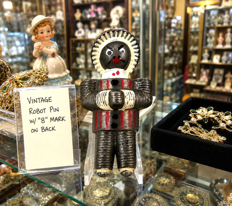 A figural robot pin brooch straight out of the Atomic Age — wearable sci-fi history that stops people mid-conversation.