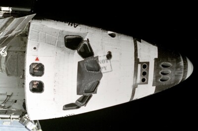 STS-74 astronauts Peer at Mir Space Shuttle Atlantis 8X12 PHOTOGRAPH