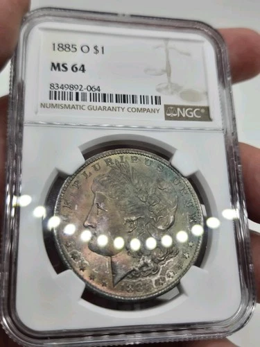 1885 O Morgan Silver Dollar NGC MS64 Rainbow Toned Obverse