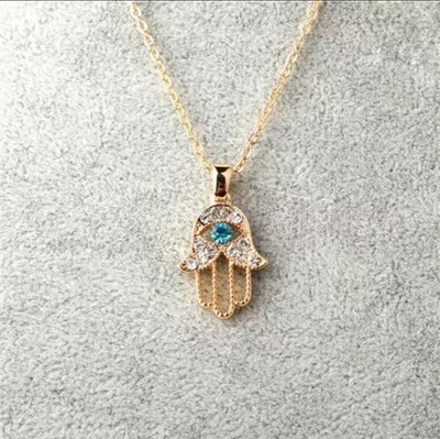 Fatima's hand-shaped necklace with an evil eye bead/kol27