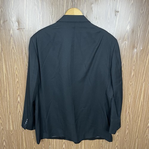 Black men's blazer jacket with notch lapels, three-button front closure, and long sleeves, hanging on wooden hanger.