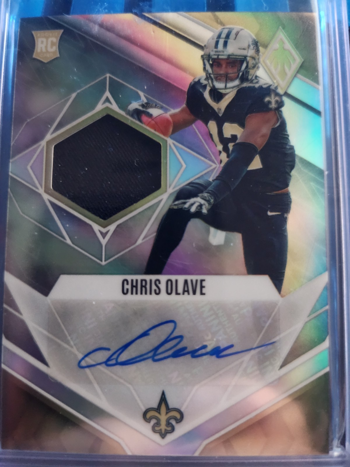 Chris Olave #RJA-CO Football Cards 2022 Panini Phoenix RPS Rookie Auto Jersey trading card — raw and PSA graded price guide