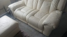 cream leather sofa used in good condition very comfortable two seater.