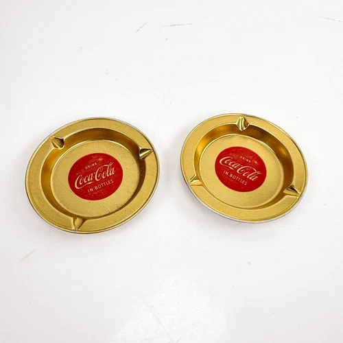 2 Vintage Drink Coca Cola Aluminum Goldtone Disposable Ash Trays Approx 3.5”
