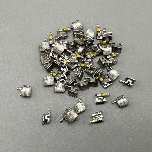 50 pezzi staffe ortodontiche dentali staffe STD MBT 022 slot 3 ganci metallo sfuso - Foto 19 di 24
