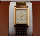 Vintage Seiko Slim Quartz Men's Wrist Watch White  Dial with Gold Bracelet.