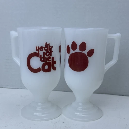 2 Arctic Cat Milk Glass Pedestal Mug Cup Year of the Cat Paw Print Vintage