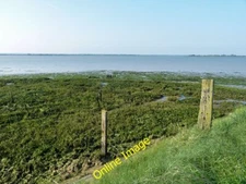 Photo 6x4 Signs of old fencing on the sea wall Osea Island It looks as if c2014