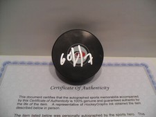 Dmitry Orlov Autographed Signed Carolina Hurricanes Puck COA - Bright Silver Pen