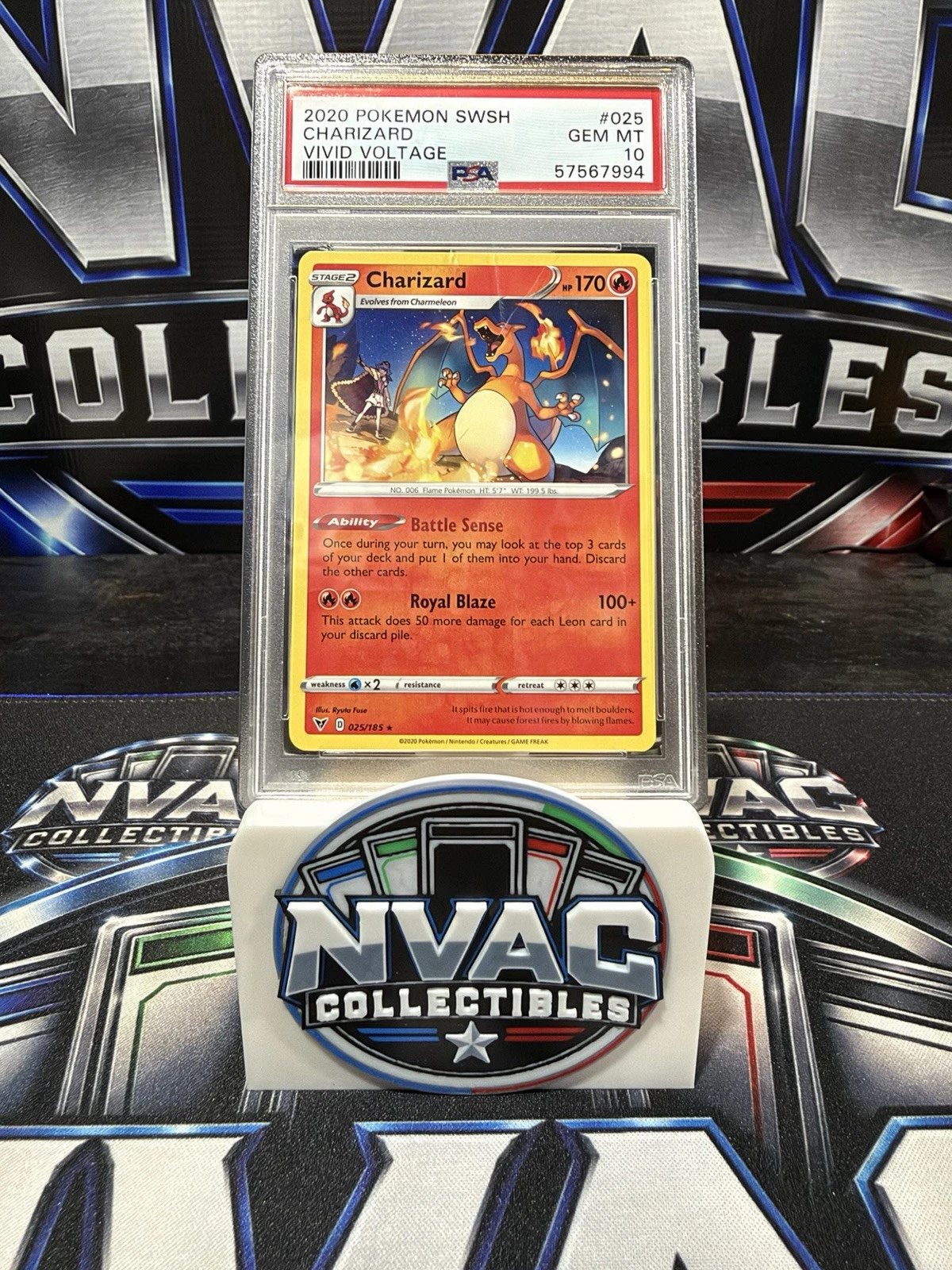 A graded Pokemon card held up in its holder