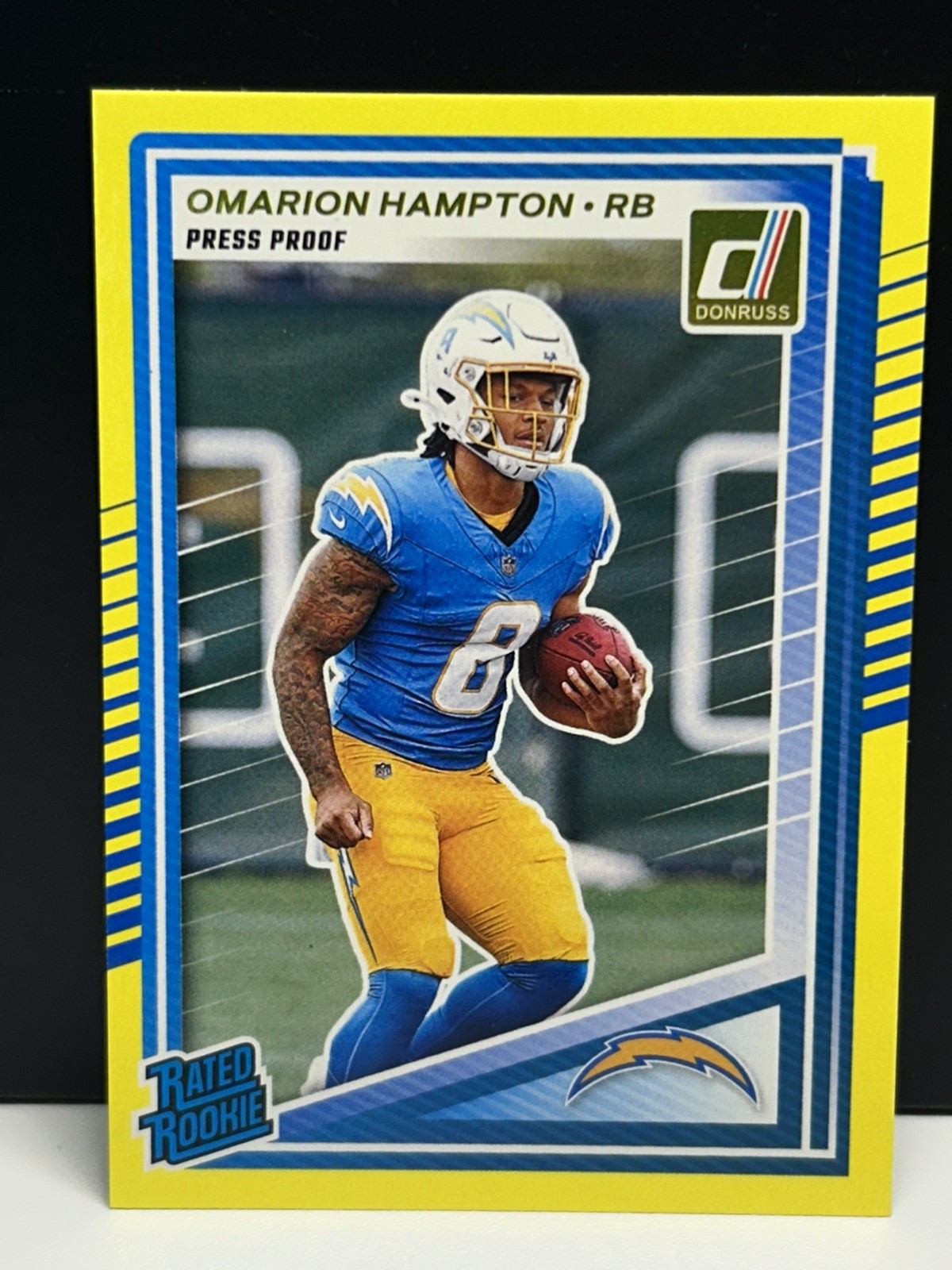 2025 Panini Donruss Rated Rookie Press Proof Yellow Omarion Hampton RC #303