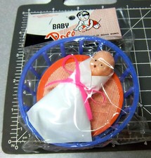 1960s Toy Baby in a Basket, made in Hong Kong still in Cellophane Wrapper