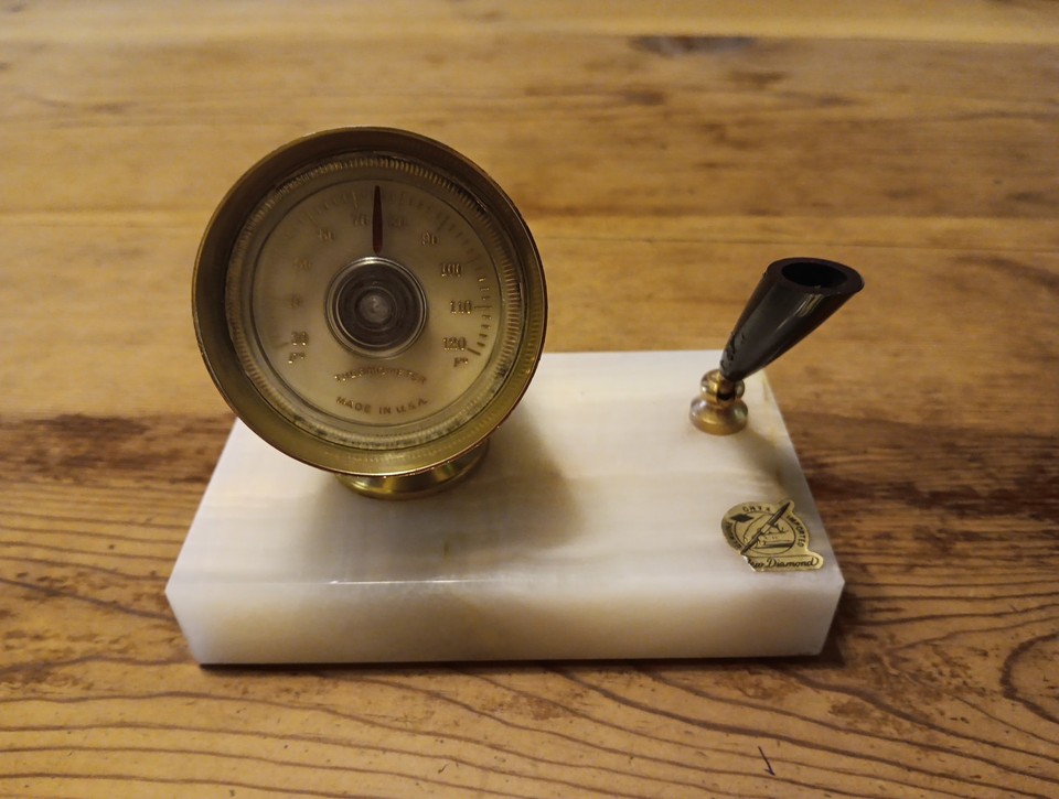 A working onyx-base desk set with a functioning quartz thermometer and pen holder — practical retro science meets MCM style.
