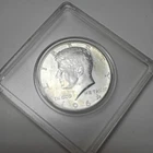 1964 Kennedy Half Dollar 90Silver.This coin is encapsulated appears uncirculated