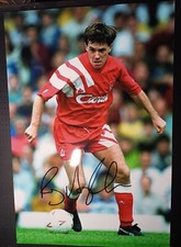 ray houghton liverpool dribbles the ball during the match signed 12x8 photo