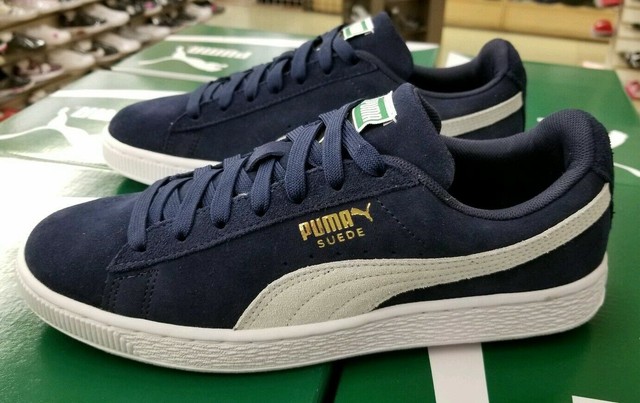 navy blue and white pumas
