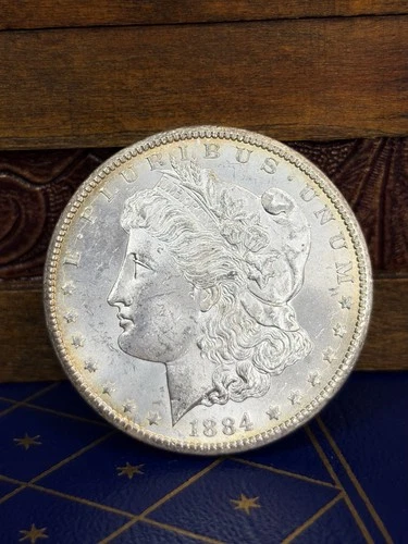 1884 BU Carson City Morgan Dollar | COMES W CAPTIAL HOLDER**