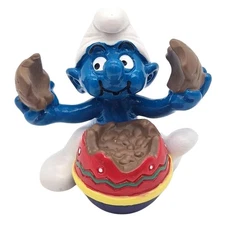 Schleich® The Smurfs Figurine - Smurf eating Easter egg (520516)