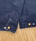Black Carhartt J01 BLK Detroit jacket with front snap buttons, two chest flap pockets, and white stitching on collar and seams.
