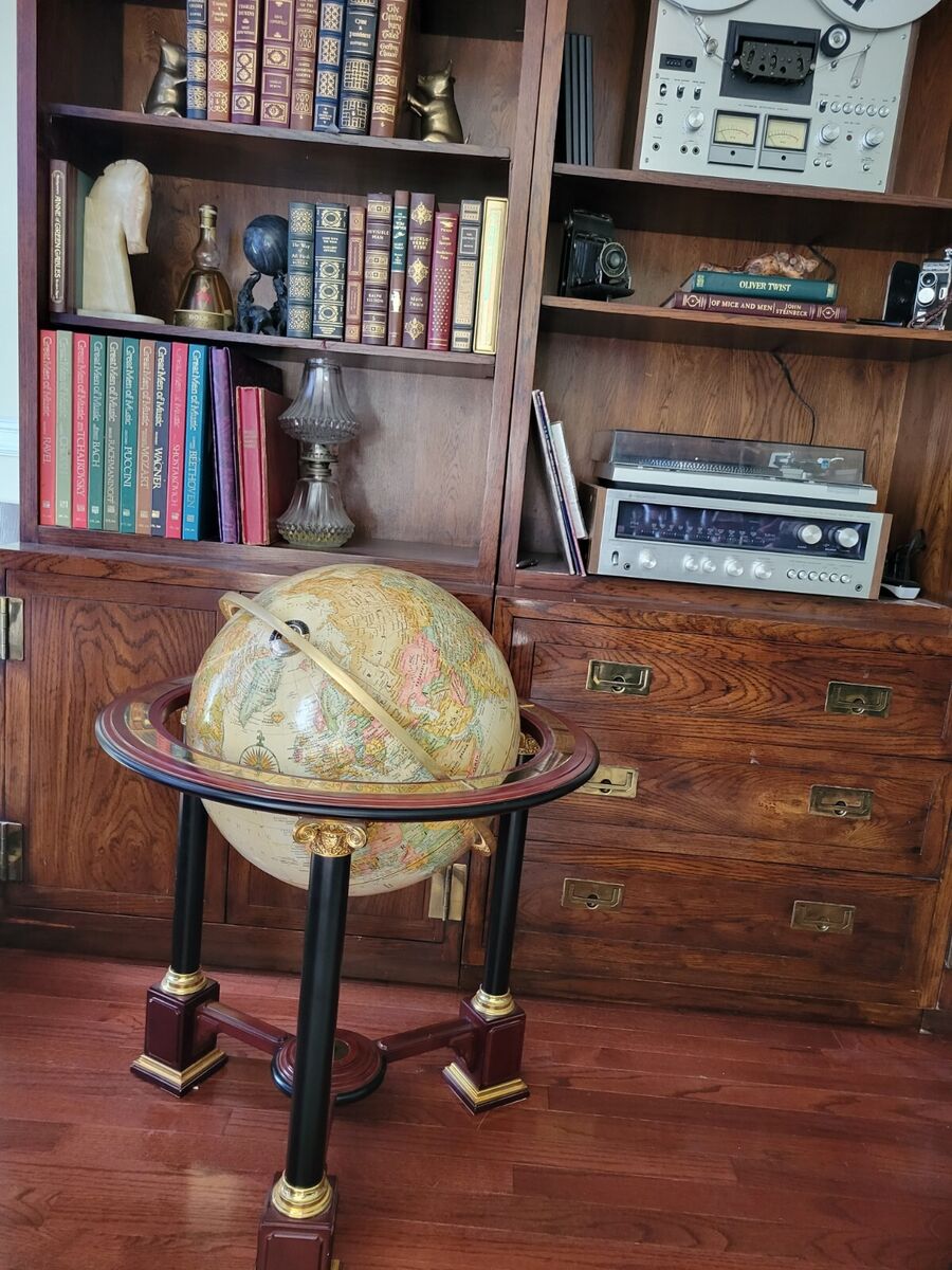 Sold at Auction: Royal geographical Society world globe on wooden