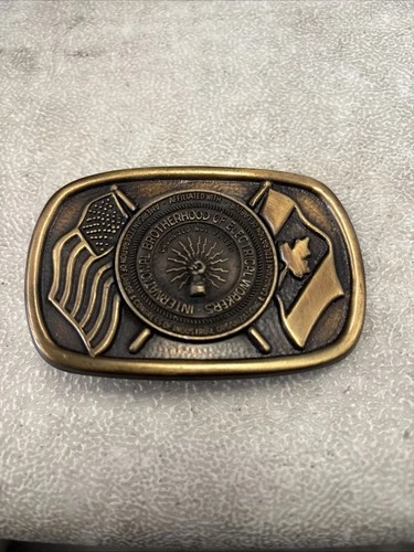 VTG IBEW Brass Belt Buckle Iconic Logo USA Canadian Flags - product listing photo
